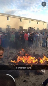 A submitted photo from snapchat of furniture burning in the Oakwood Apartment complex volleyball courts. Oakwood is an off-campus student housing complex.