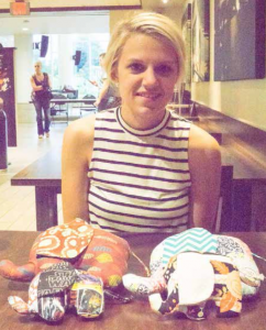 Ashley Modrzynski displays custom stuffed elephants that she crafts and donates to local hospitals.
